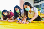 มมส สืบสานประเพณี จัดพิธีทำบุญและจารึกชื่อบนแผ่นผ้าไหมดิ้นทอง ทอดถวายองค์พระธาตุนาดูนเนื่องในวันมาฆบูชา